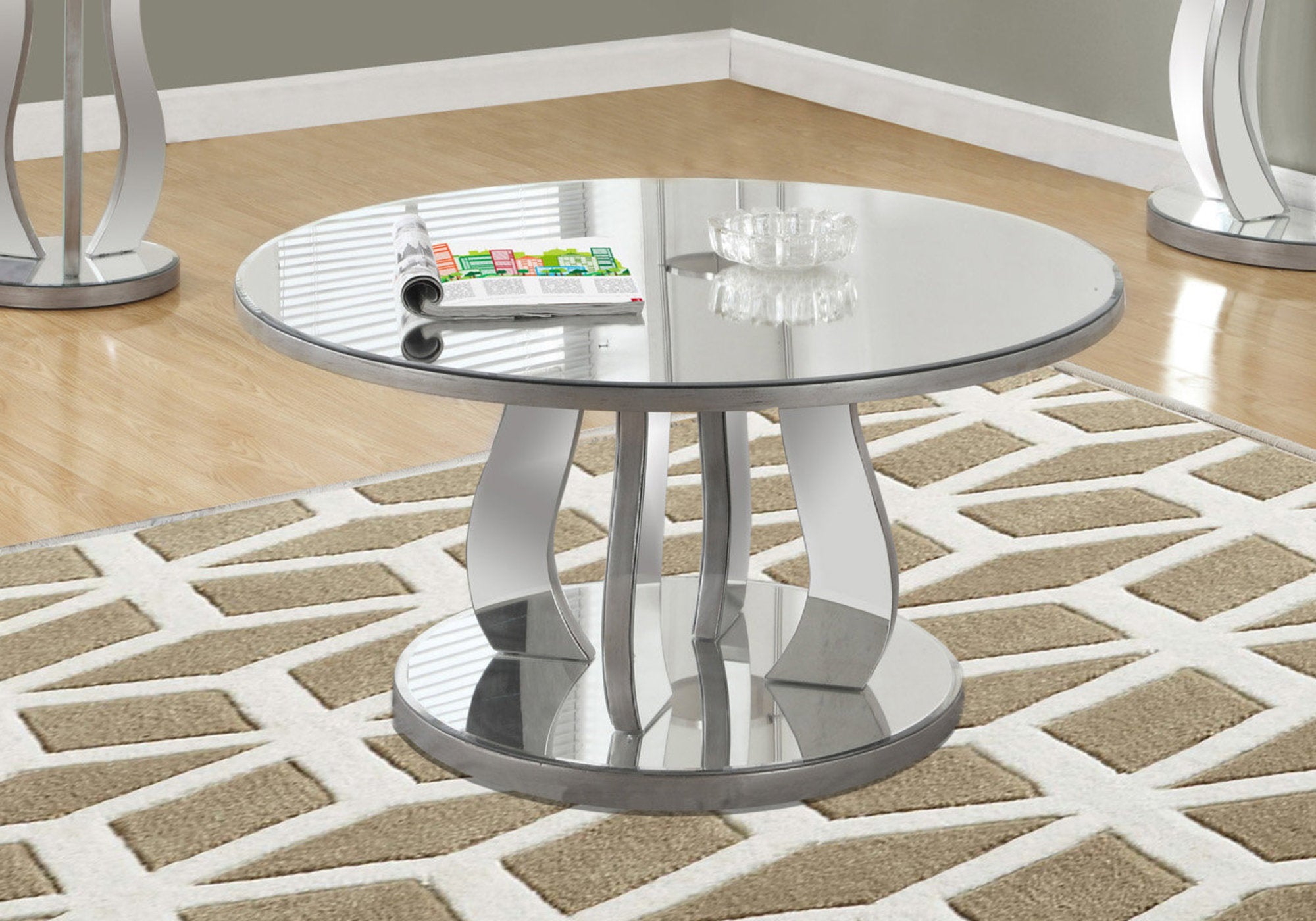 Image of coffee table - 36inch dia brushed silver mirror  i 3725.